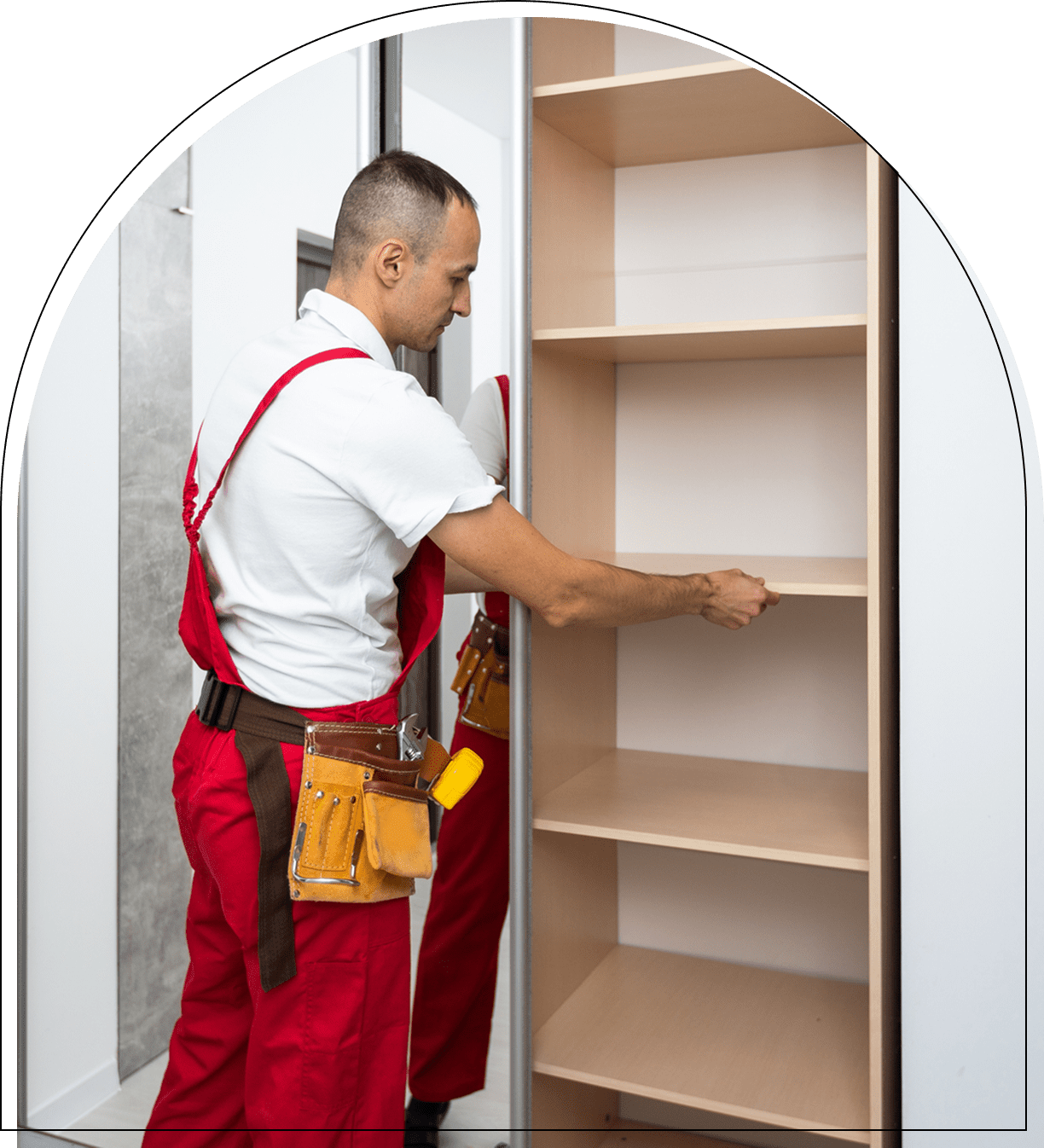 Worker installing shelves in a closet.